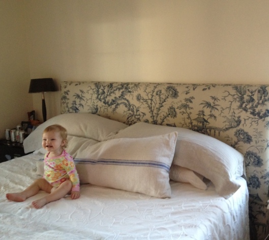 Before: The linen headboard looks dirty against the cream wall. It did not seem to bother my design assistant sitting on the bed ;)
